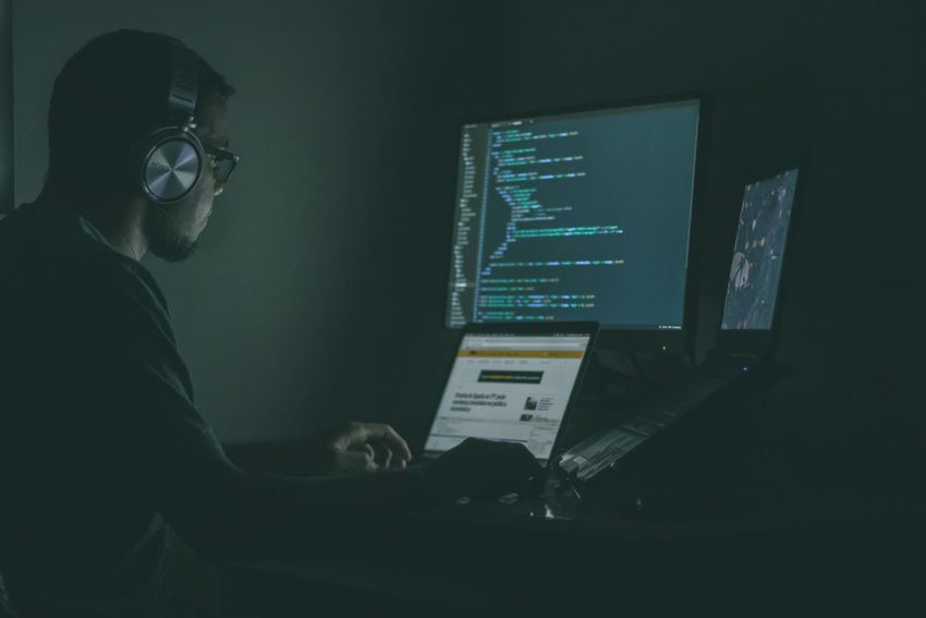A computer programmer working late at night